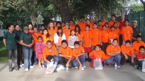 "parent and community volunteers in orange t-shirts"